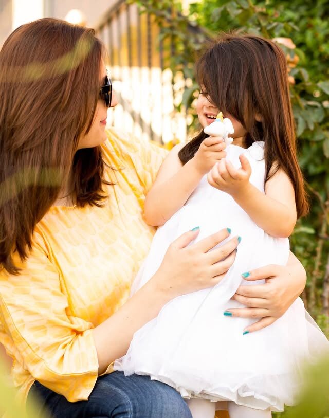 Family enjoying playful moment with child
