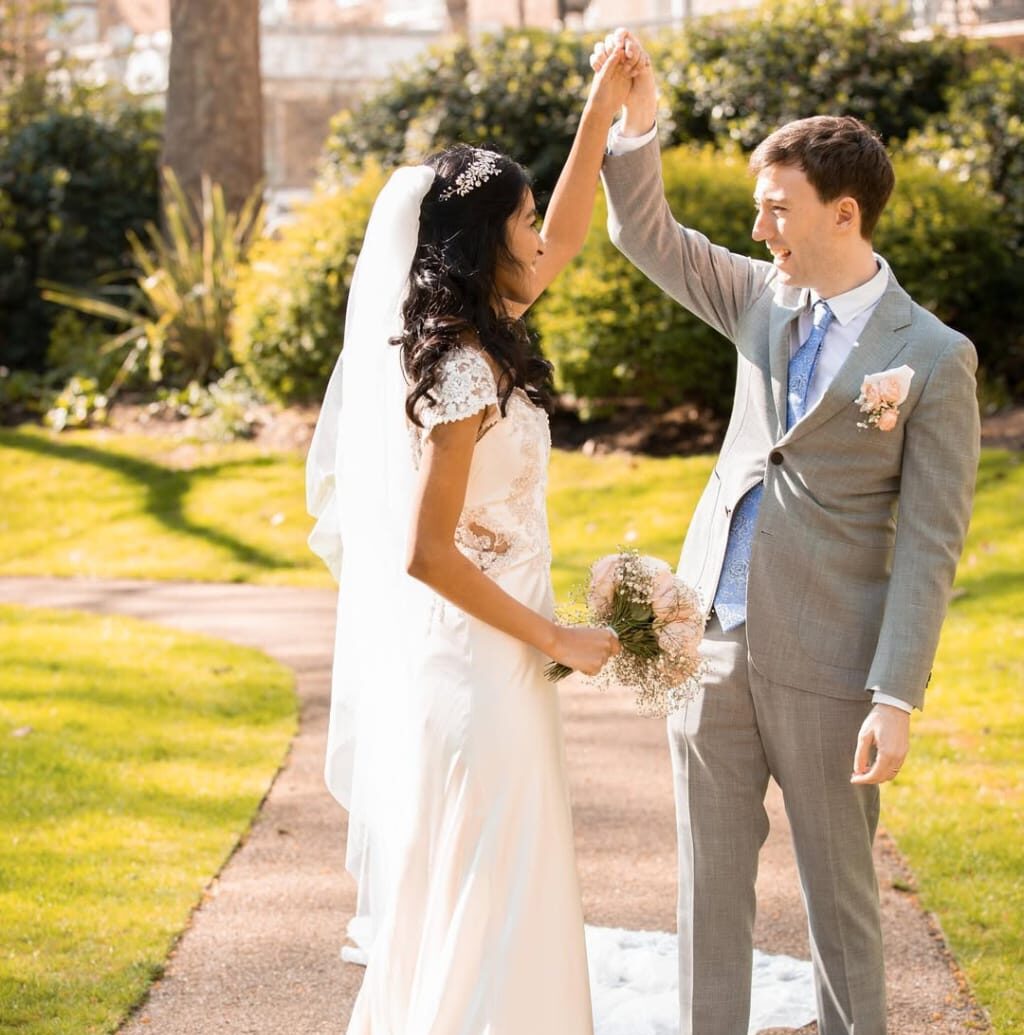 Groom walking casually in a green garden during Fatography pre wedding photography.
