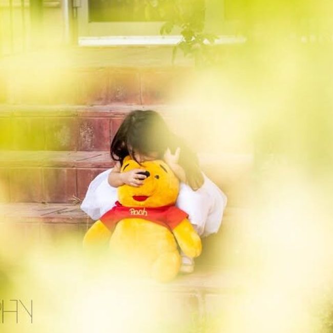 Child walking on grass with yellow outfitChild walking on grass with yellow outfitChild walking on grass with yellow outfit