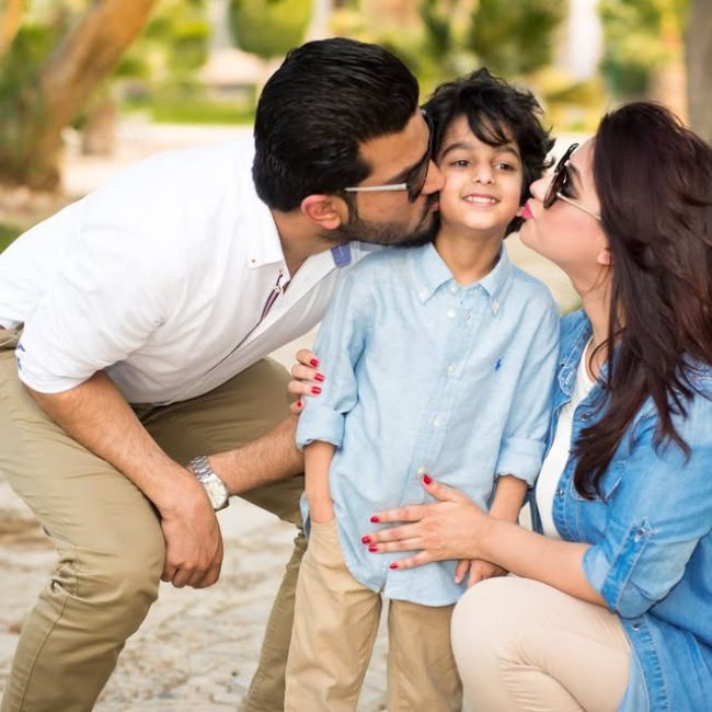 Family laughing together during outdoor session