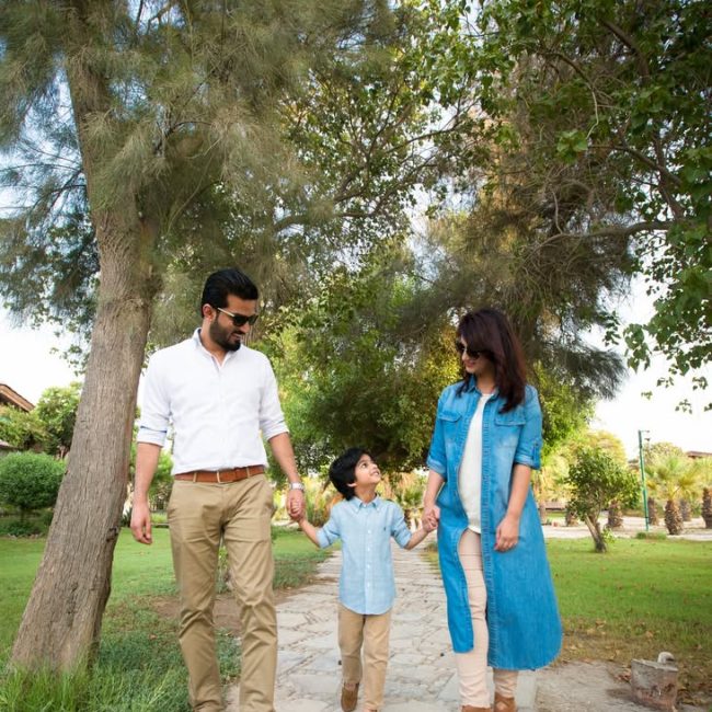 Mother holding baby close in soft sunlight