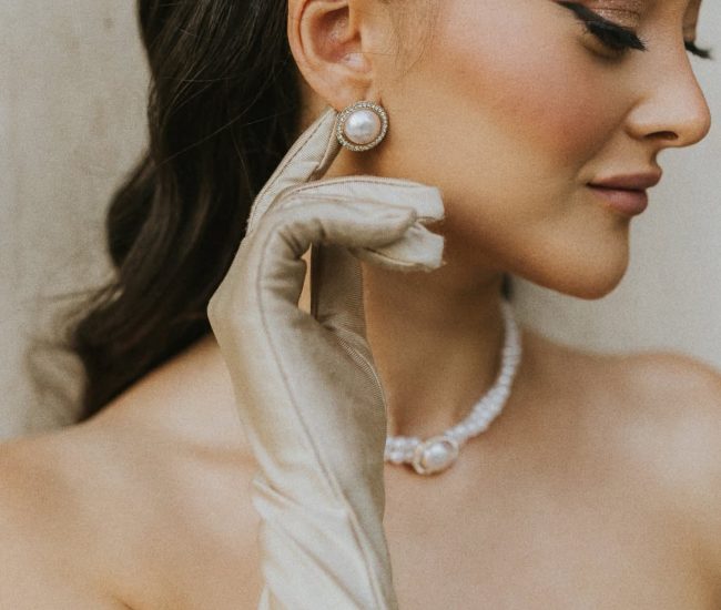 Couple leaning against a stylish building wall during Fatography pre wedding photography.