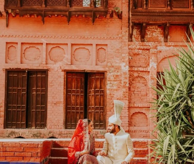 Couple pre-wedding photoshoot near traditional village well