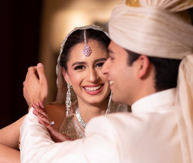 Creative pre-wedding photo with couple reflection in hall mirror