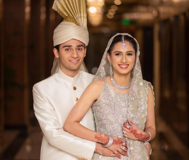 Couple pre-wedding shoot at grand entrance of marriage hall