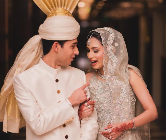 Pre-wedding couple dancing in wedding hall with lights