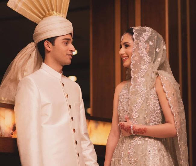 Couple pre-wedding photoshoot on decorated marriage hall stage