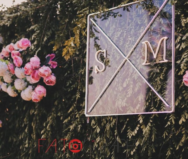 The bride twirling in her elegant green dress with a joyful expression, captured during an outdoor portrait session.