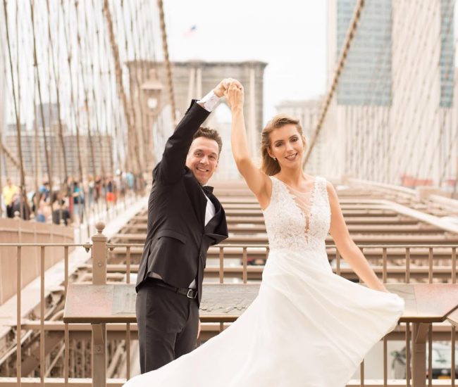 Groom gazing at city view from bridge in a Fatography pre wedding photoshoot.