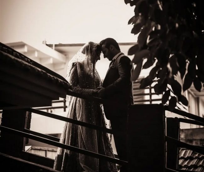 Pre-wedding shoot of couple in home garden at sunset