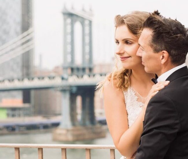 Groom posing side profile near bridge railing in a Fatography pre wedding photoshoot.
