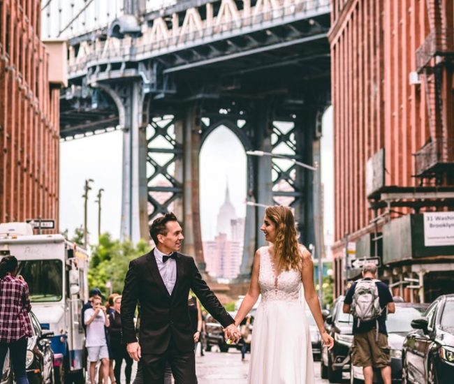 Groom standing on steps leading to the bridge during a Fatography pre wedding shoot.
