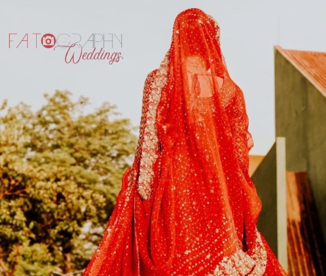 Couple riding tractor during pre-wedding shoot in village