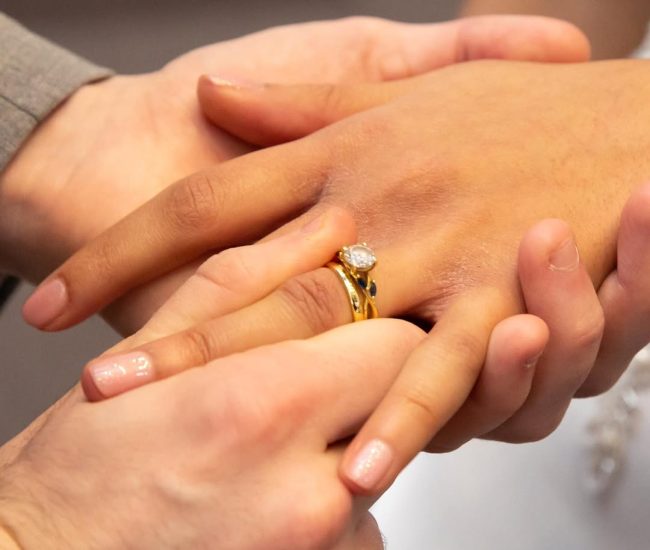 Natural candid portrait of groom in a garden during a Fatography pre wedding session.