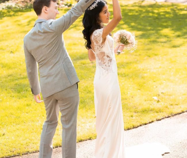 Close-up shot of groom standing near flowers in a Fatography pre wedding garden shoot.