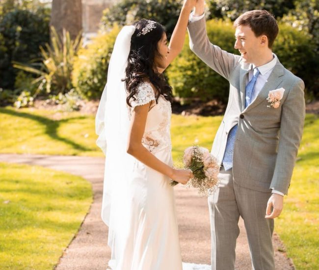 Groom walking casually in a green garden during Fatography pre wedding photography.