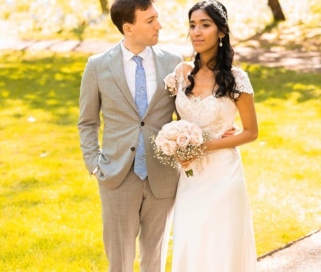 Groom standing confidently on the street during a Fatography pre wedding shoot.
