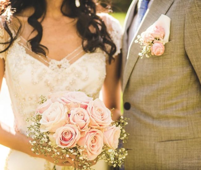 Groom standing at a crossroad in the city street during a Fatography pre wedding photoshoot.