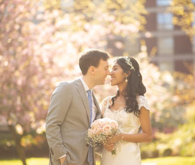Groom standing at a crossroad in the city street during a Fatography pre wedding photoshoot.
