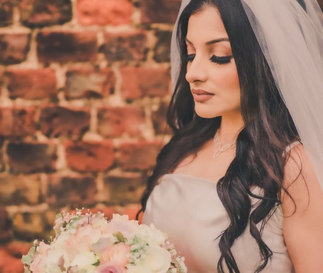 Bride holding wedding bouquet during pre-wedding shoot