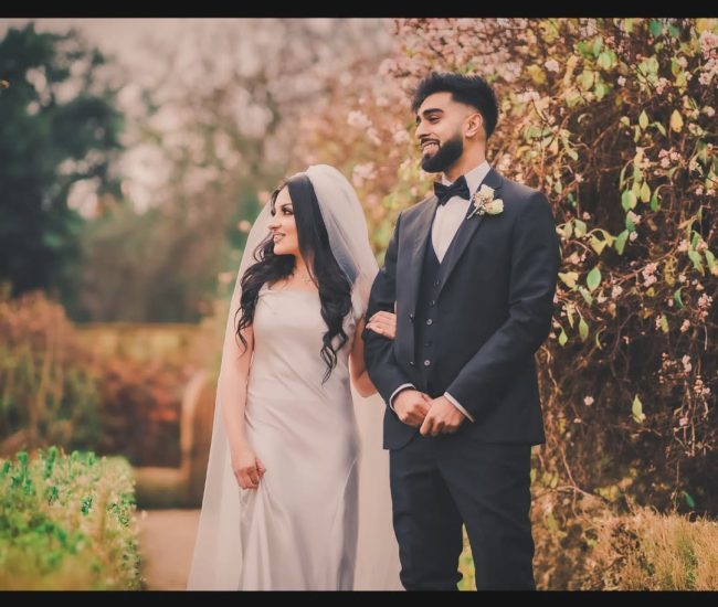 Couple leaning close to each other in romantic pre-wedding garden shoot