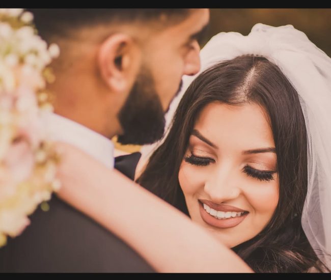 Couple touching foreheads during romantic outdoor pre-wedding shoot