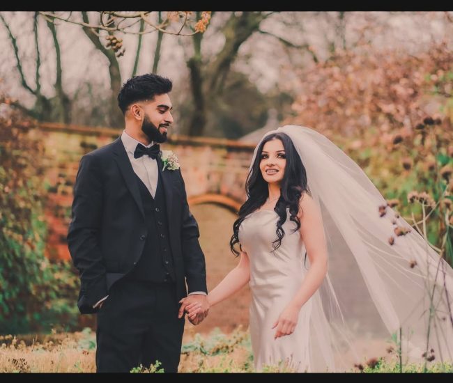Pre-wedding couple smiling happily in outdoor photoshoot