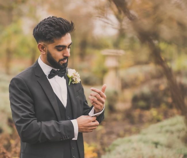 Pre-wedding couple sitting together at decorated table indoors