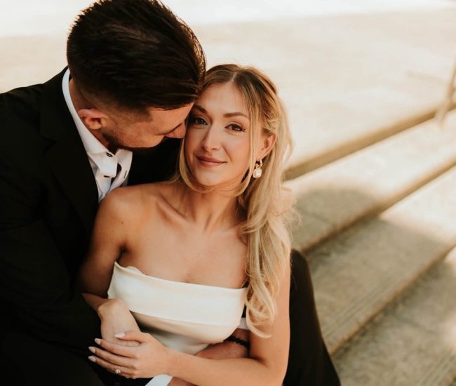 Couple posing at a metro station in a Fatography pre wedding city shoot.