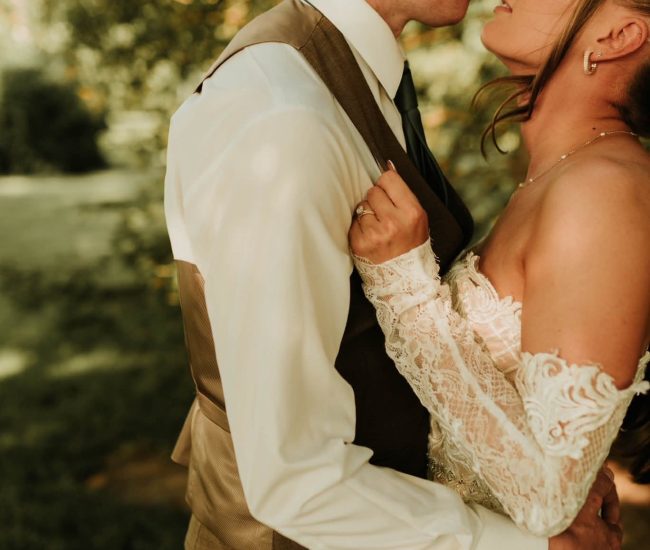Couple hugging in a green garden during a Fatography pre wedding photography session.