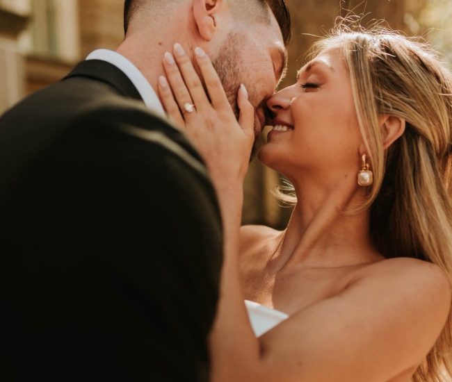 Couple enjoying vibrant colors in a city market during a Fatography pre wedding session.