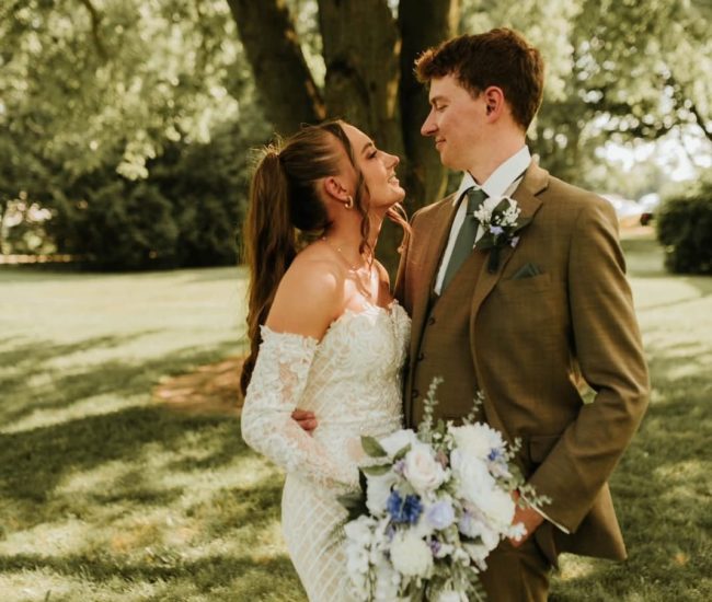 Bride and groom sitting under a tree shade during a Fatography pre wedding garden shoot.