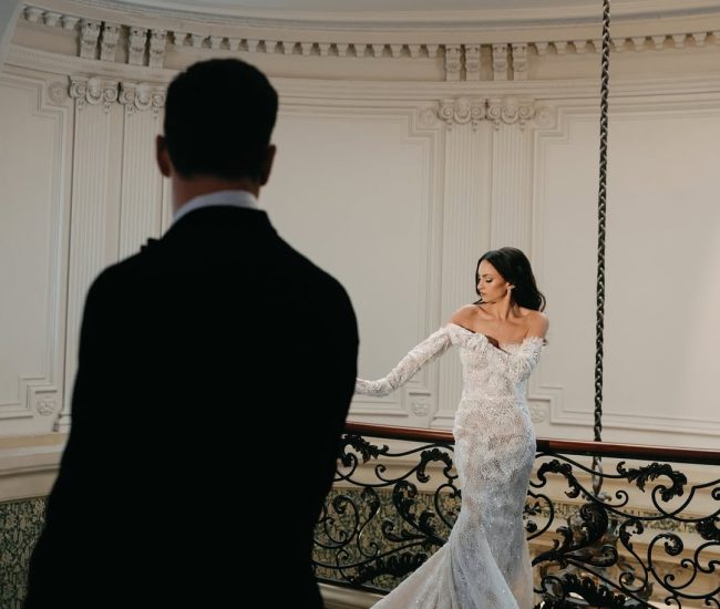 Modern look indoor shoot with bride in white suit and groom in black suit by Fatography pre wedding team.