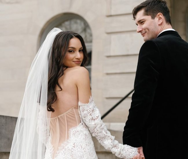 Stylish couple indoor portrait with bride in white suit and groom in black captured by Fatography pre wedding photography.
