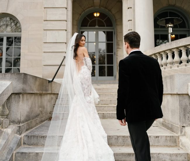 Bride in white and groom in black posing in studio for a Fatography pre wedding shoot.