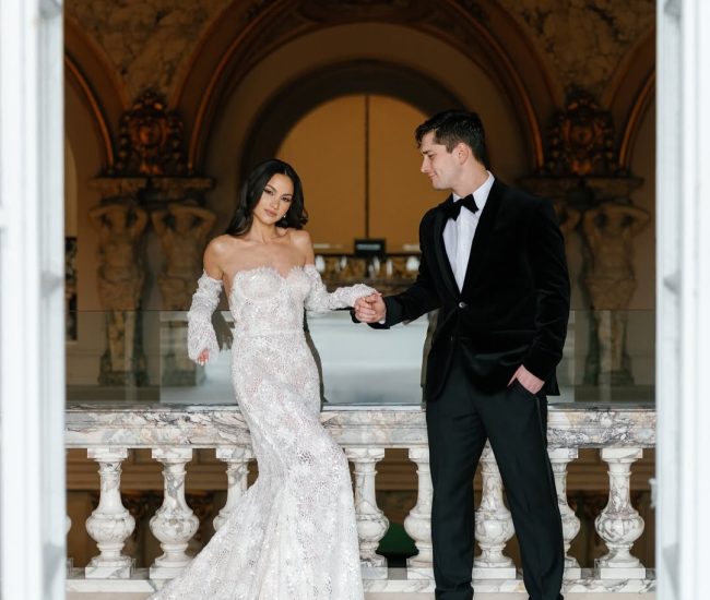 Elegant indoor portrait of bride in white suit with groom in black by Fatography pre wedding photography