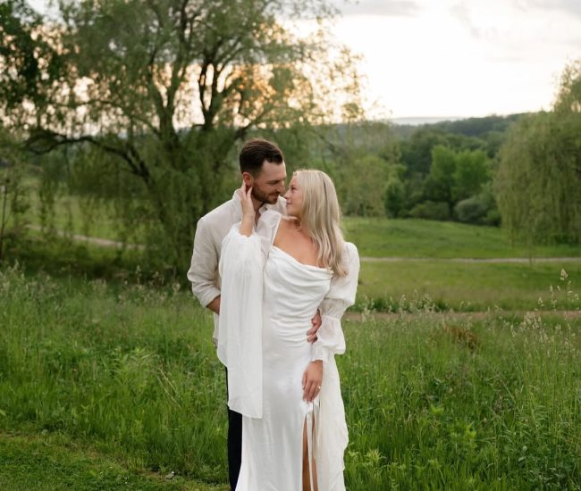 Romantic couple walking on a forest path in a Fatography pre wedding session.