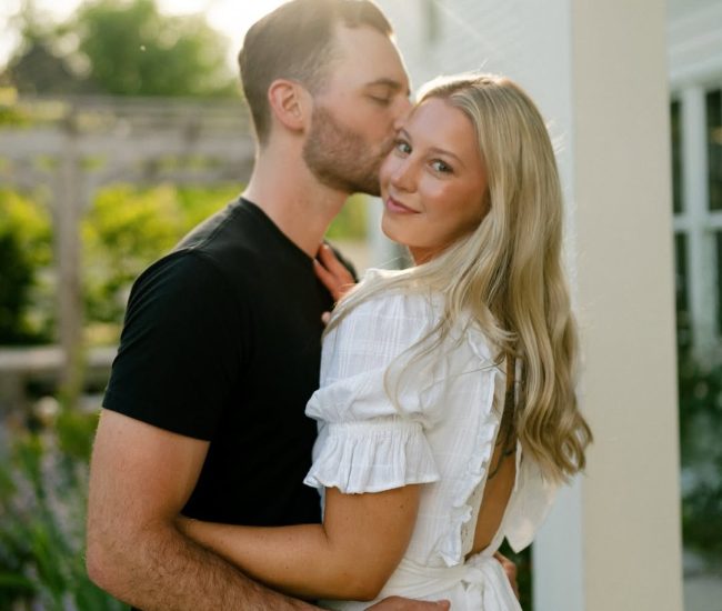 Couple posing in a lush green garden during a Fatography pre wedding shoot.