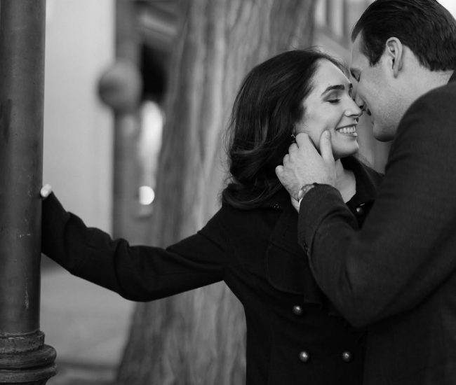 Couple sitting by the riverbank in a Fatography pre wedding photoshoot.
