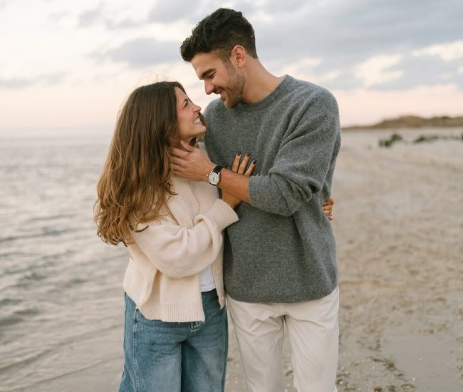 Couple reading together in a library during a Fatography pre wedding session.