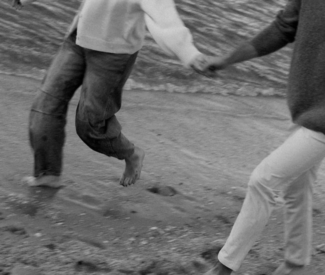 Bride and groom posing in a flower field during a Fatography pre wedding shoot.