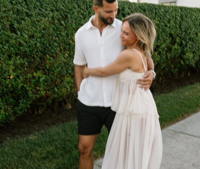 Couple posing on a staircase in a Fatography pre wedding photography session.