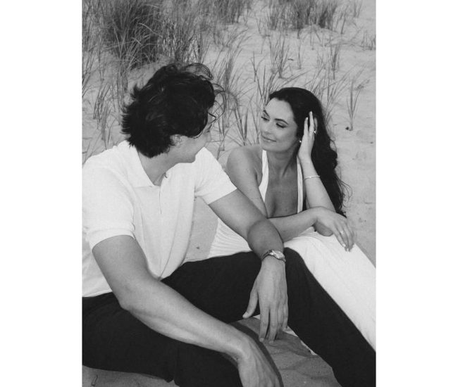 Couple sitting together for a romantic Fatography pre wedding photography session.