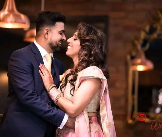 Romantic indoor pre-wedding photography in soft candlelight