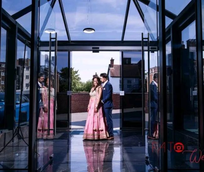 Indoor pre-wedding photography in a luxury hall with chandeliers