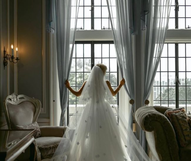 Couple enjoying a rooftop view of the city during a Fatography pre wedding session.